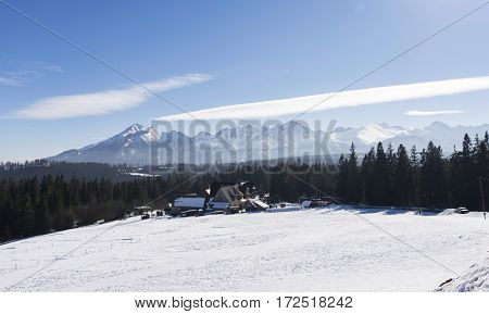 Winter mountains covered with snow view from a big meadow in Tatry mountains in Poland