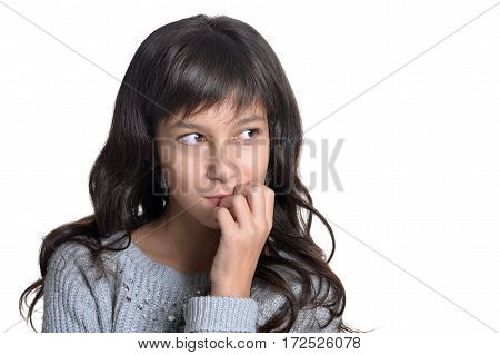 beautiful teen girl posing against white background