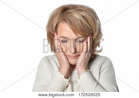 Closeup portrait, morose elderly lady, downcast gloomy, resting face on hands isolate on white