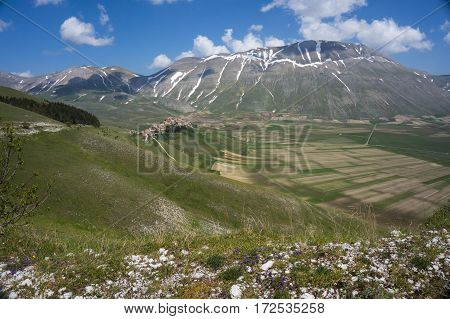 Beautiful view of the old italian mountain village Castelluccio, picturesque Apennine landscape, Norcia, Italy