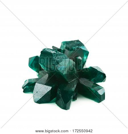 Grown crystal of green colored salt isolated over the white background