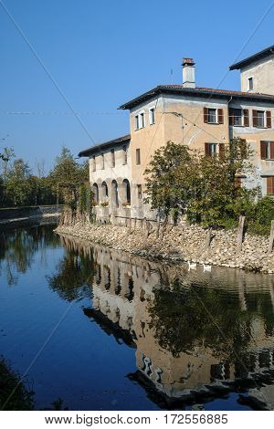 Country house along the Naviglio Grande of Turbigo (Milan Lombardy Italy) at fall with geese
