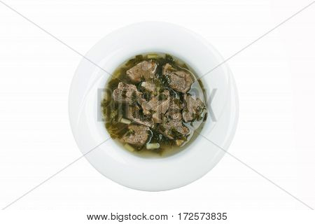 boiled meat with fresh herbs chakapuli  traditional Georgian dish white background top view