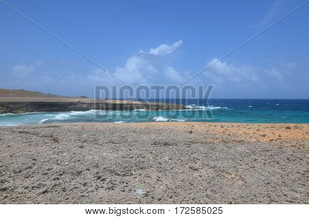 Daimari beach with waves rolling ashore in Aruba.