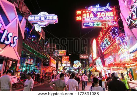 Walking Street in Pattaya at night PATTAYA, THAILAND - DECEMBER 23, 2016: The street is a tourist attraction that draws foreigners and Thai nationals, The Walking Street area includes seafood restaurants, beer bars, nightclubs and hotels.