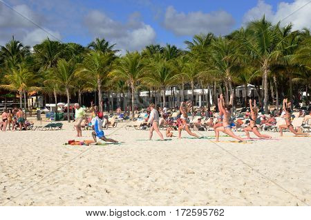 Playa del Carmen Mexico - January 28 2017: Keep fit class on caribbean beach