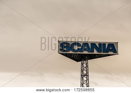 Koblenz, Germany - 20.02.2017 : Sign tower Scania trucks Logo against cloudy sky sunset at german service headquater
