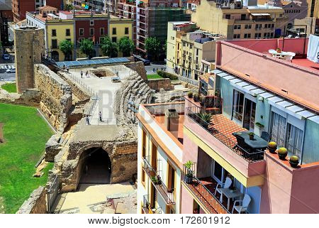 TARRAGONA/ SPAIN - MAY 16. The Roman circus and the Tower of nuns of the 14th century surrounded by typical spanish residential houses on May 16, 2015. Tarragona, Spain.
