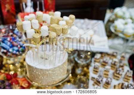 Different Swets And Cup Cakes At Wedding Reception.