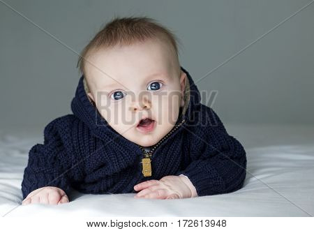 Baby In Blue Sweather