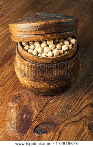 Portion of Chick Peas in wooden bowl.