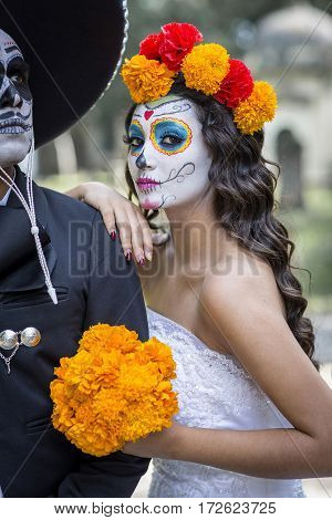 Bridal Couple With Makeup And Costumes Typical Mexican In A Cementery.