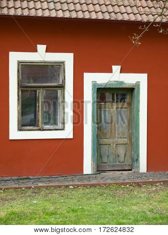 Vintage wooden door and vindow on village house in Czech republic