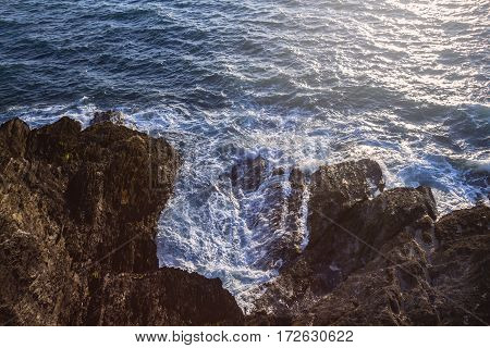 Ocean waves lapping on the rocks. View from above. Capstone Hill. Ilfracombe. North Devon. UK