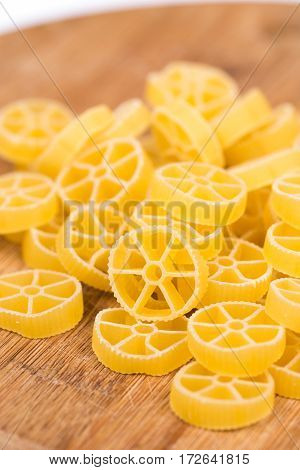 Raw Unboiled Pasta On The Kitchen Cutting Board