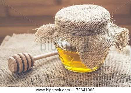 Bank Of Honey With A Spoon For Honey
