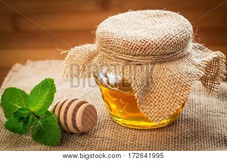 Bank Of Honey With A Spoon For Honey