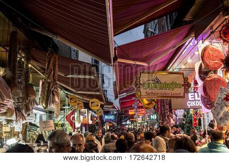 ISTANBUL TURKEY - DECEMBER 29 2015: Picture of Hasircilar Street at rush hour heavily crowded near the Egyptian bazaar aka Spice Market