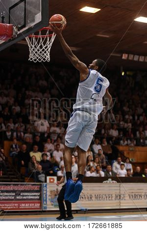 KAPOSVAR, HUNGARY - FEBRUARY 4: Winsome Frazier (in white) in action at Hungarian Championship basketball game with Kaposvar (white) vs. Pecsi VSK (black) on February 4, 2017 in Kaposvar, Hungary.