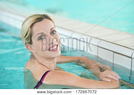 Blond woman relaxing in spa pool