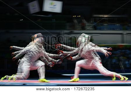RIO DE JANEIRO, BRAZIL - AUGUST 13, 2016: Team United States (L) competes against Team Poland in the Women's Sabre Team of the Rio 2016 Olympic Games at Carioca Arena 3