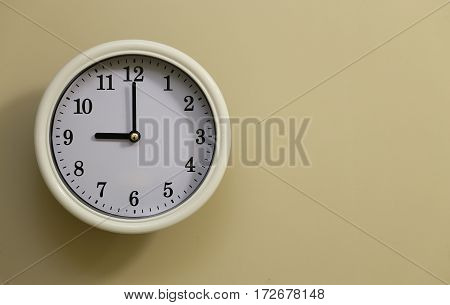 The time for wall clock of the room is 9:00