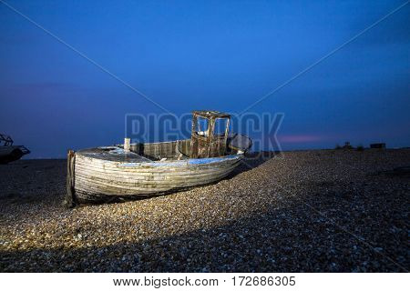 Shipwreck in the dusk on England`s coastline
