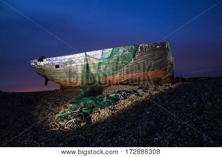 Shipwreck in the dusk on England`s coastline
