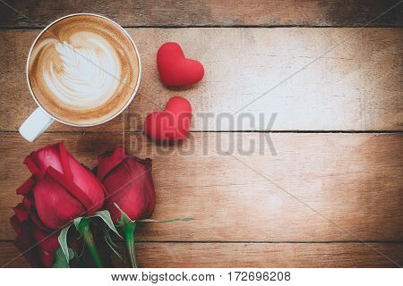 Red rose heart and cup of coffee on wooden background with copy space.Valentines Day background concept Wedding day.Top view vintage tone