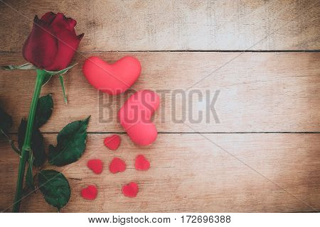 Red roses and heart on wooden background with copy space.Valentines Day background concept Wedding day.Top view vintage tone