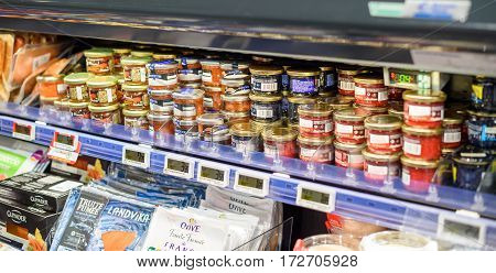 PARIS FRANCE - DEC 21 2016: Large selection of French delicatessen - fish eggs red roe red caviar baked salmon in Simply supermarket - part auf Auchan
