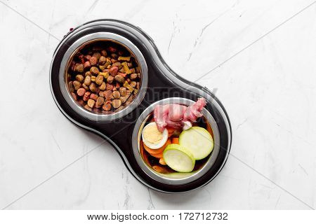 Fresh vegetables and dry petfood on white kitchen table background top view mock up