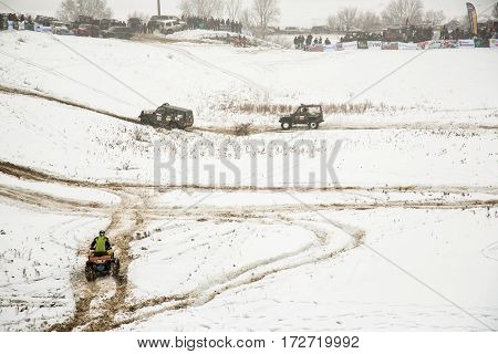 ALMATY KAZAKHSTAN - FEBRUARY 21 2013: Off-road racing on jeeps Car competition ATV. Traditional race 