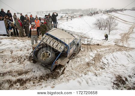 ALMATY KAZAKHSTAN - FEBRUARY 21 2013: Off-road racing on jeeps Car competition ATV. Traditional race 
