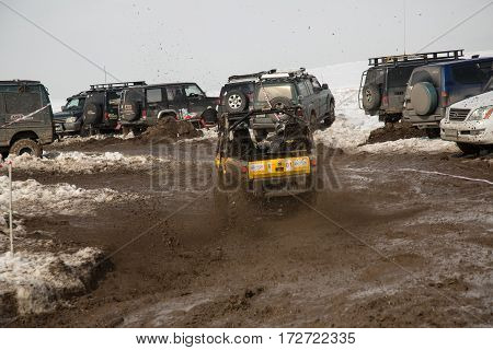 ALMATY KAZAKHSTAN - FEBRUARY 21 2013: Off-road racing on jeeps Car competition ATV. Traditional race 