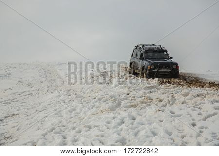 ALMATY KAZAKHSTAN - FEBRUARY 21 2013: Off-road racing on jeeps Car competition ATV. Traditional race 