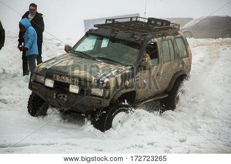 ALMATY KAZAKHSTAN - FEBRUARY 21 2013: Off-road racing on jeeps Car competition ATV. Traditional race 