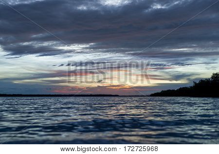 Sunrise in the caribbean sea with orange clouds