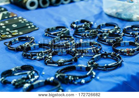 leather straps and bracelets with precious stones
