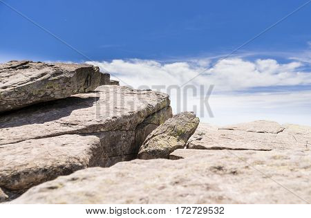 Mountain formed by stone slabs with the horizon in the background