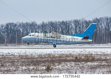 Kiev Region Ukraine - February 1 2011: Antonov An-140 regional passenger plane is taking off on a winter day