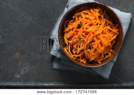 Carrots in Korean with spices on a metal table horizontal