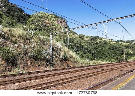 Twin Rail Tracks Leading Through Rural Railway Station