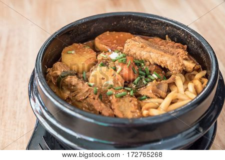 Gamjatang Korean Spicy Pork rib Soup with Kimchi and udon