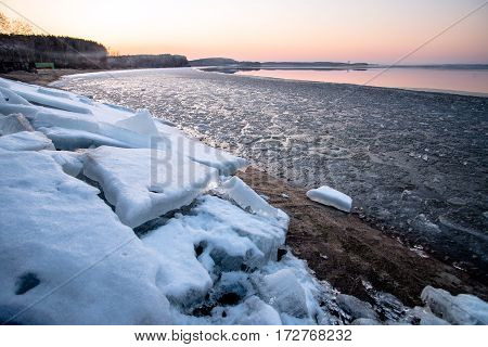 Sunset and ice on the lake in the spring