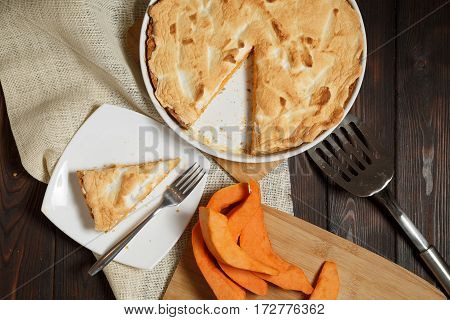 Homemade Pumpkin Pie for Thanksigiving on old wood table