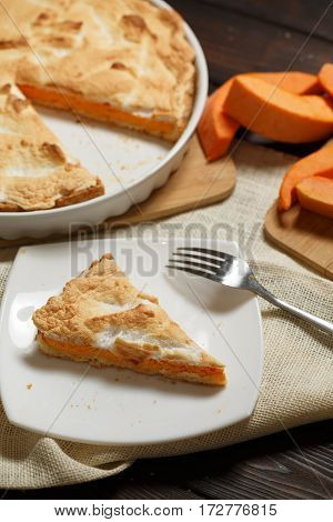 Homemade Pumpkin Pie for Thanksigiving on old wood table
