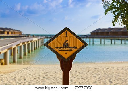 Sign on Maldives island - nature travel background