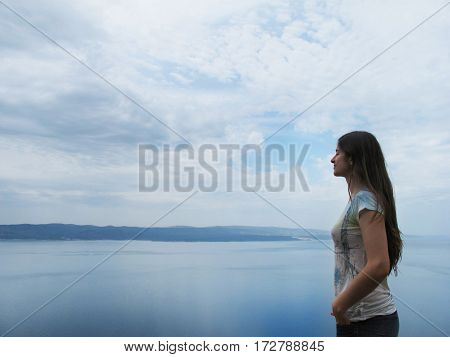 brunette woman breathing isolated in a lake