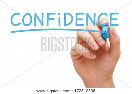 Hand writing Confidence with blue marker on transparent glass board.